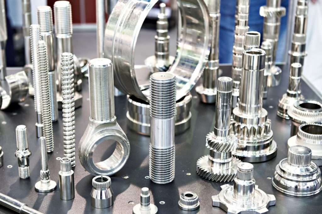 various passivated stainless steel parts in a CNC workshop