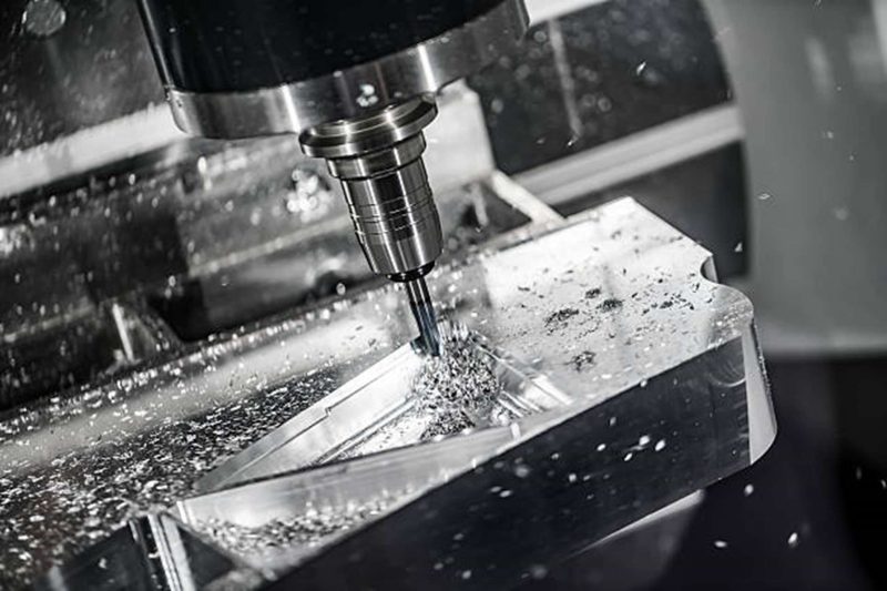 A CNC milling machine removing the material from a workpiece